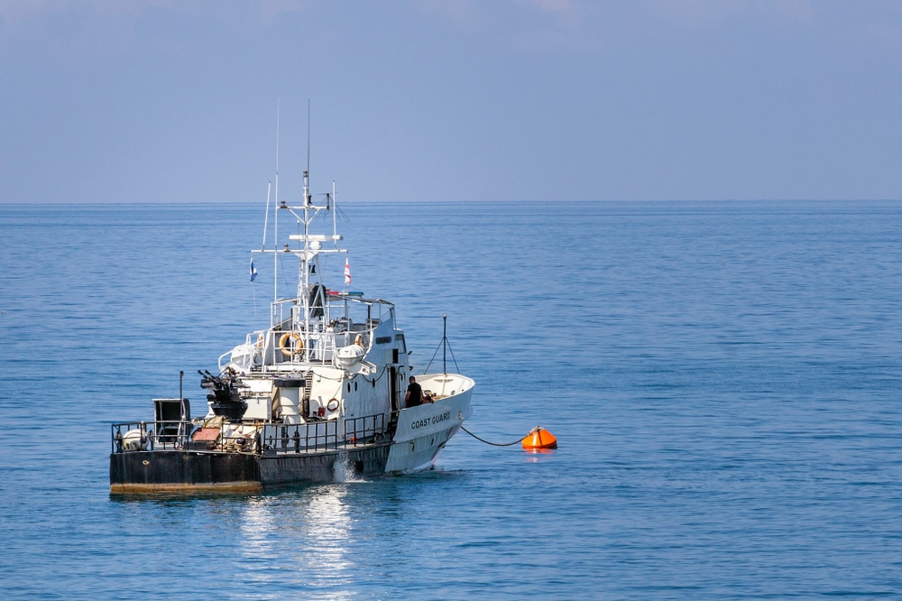 White,Black,Coast,Guard,Vessel,At,Sea.